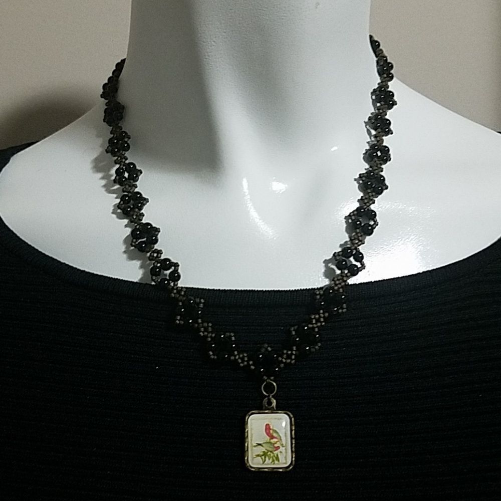 Black & Brown Beaded Necklace with a Bird Pendant